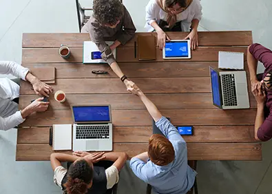 meeting table from above with people sat at it